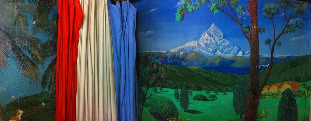 Photography studios in Nepal use aspirational backdrops, such as an idealised landscape, to allow people to shed their day-to-day identities and imagine a different life.